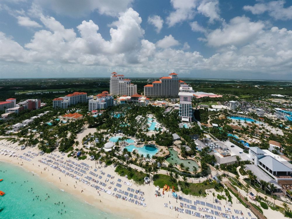 Aerial view of a beachfront resort with pools in the Bahamas